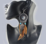 Hollow fringed feathers long paragraph earring